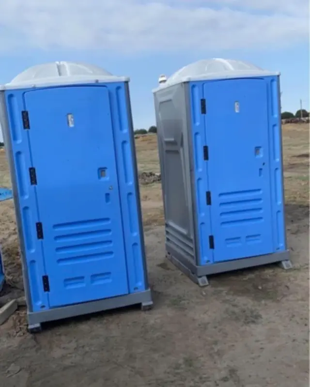 Two portable toilets on a construction jobsite